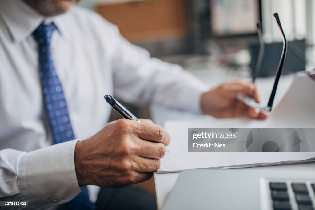 Signing the document in the office