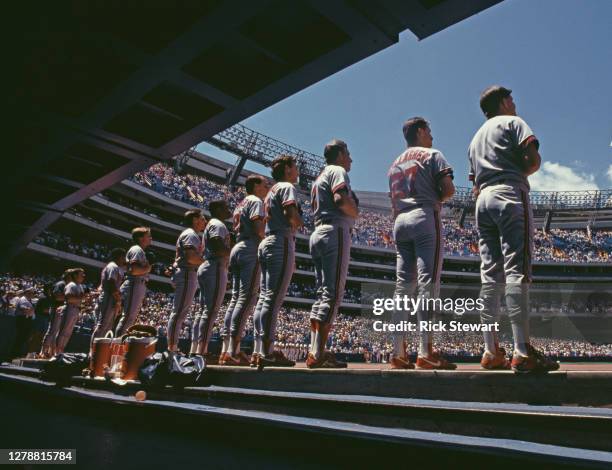 Dave Gallagher, Outfielder for the California Angels stands with his team mates above the dugout for the playing of the national anthem before the...