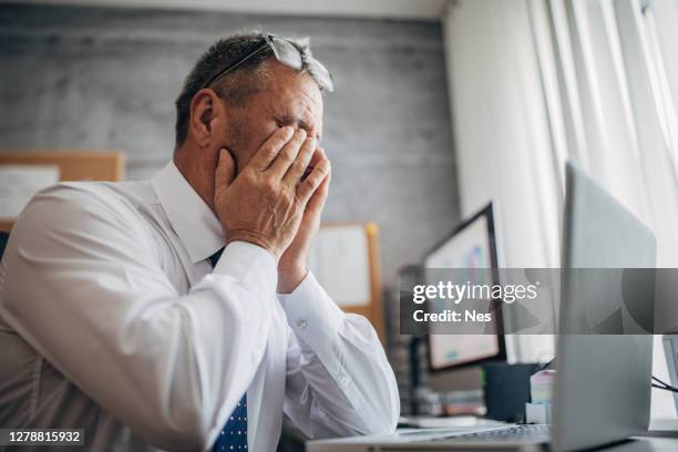 injury at work, eye fatigue - head in hands computer stock pictures, royalty-free photos & images