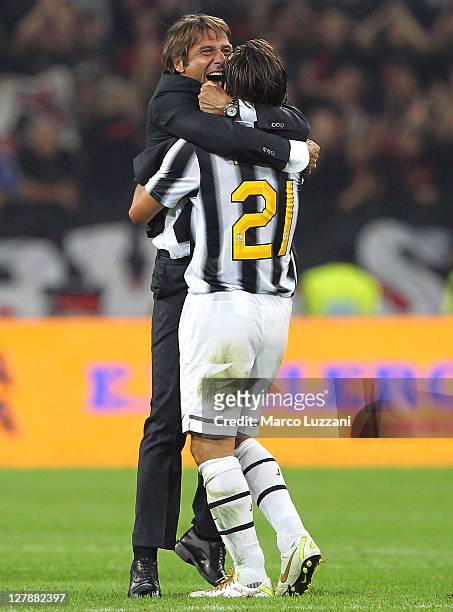 Juventus FC manager Antonio Conte celebrates vctory with Andrea Pirlo at the end the Serie A match between Juventus FC and AC Milan on October 2,...
