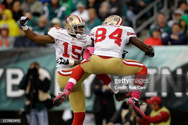 Michael Crabtree of the San Francisco 49ers celebrates with teammate Josh Morgan after Morgan scored a touchdown against the Philadelphia Eagles...