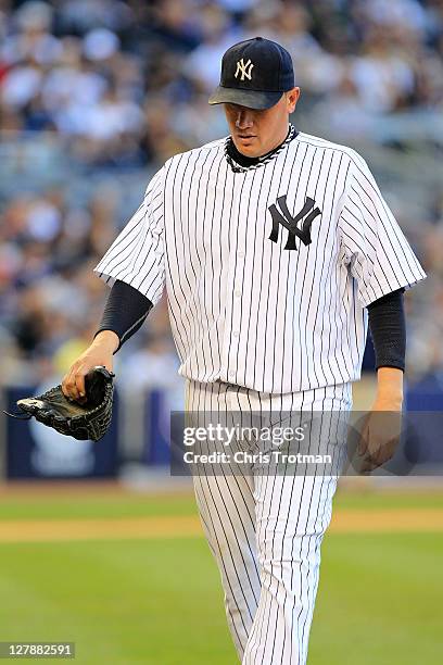 Freddy Garcia of the New York Yankees walks off the field after being pulled in the sixth inning of Game Two of the American League Division Series...