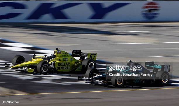 Ed Carpenter in his Dollar General Sarah Fisher Racing Dallara Honda beats Dario Franchitti, driver of the Downey Chip Ganassi Racing Dallara Hinda...