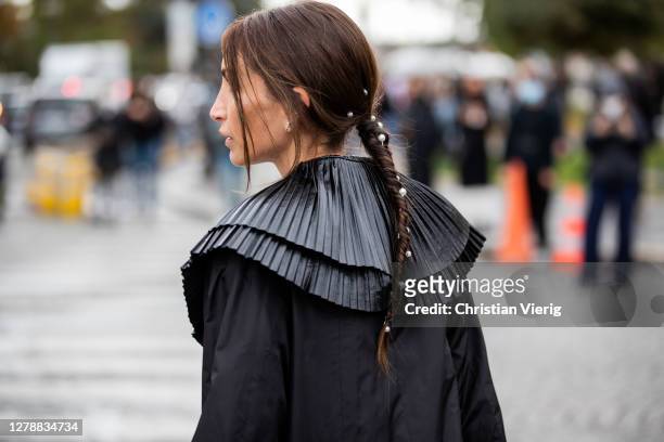 Chloe Harrouche seen wearing black coat, hair clip, pearls outside Chanel during Paris Fashion Week - Womenswear Spring Summer 2021 : Day Nine on...