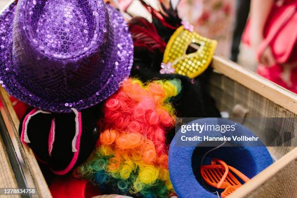 party hats and dress up clothes - wig stock pictures, royalty-free photos & images