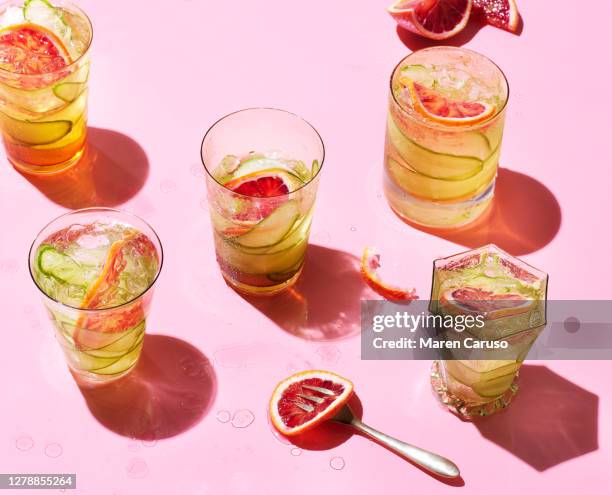 cocktails on pink background - soft drink stock pictures, royalty-free photos & images