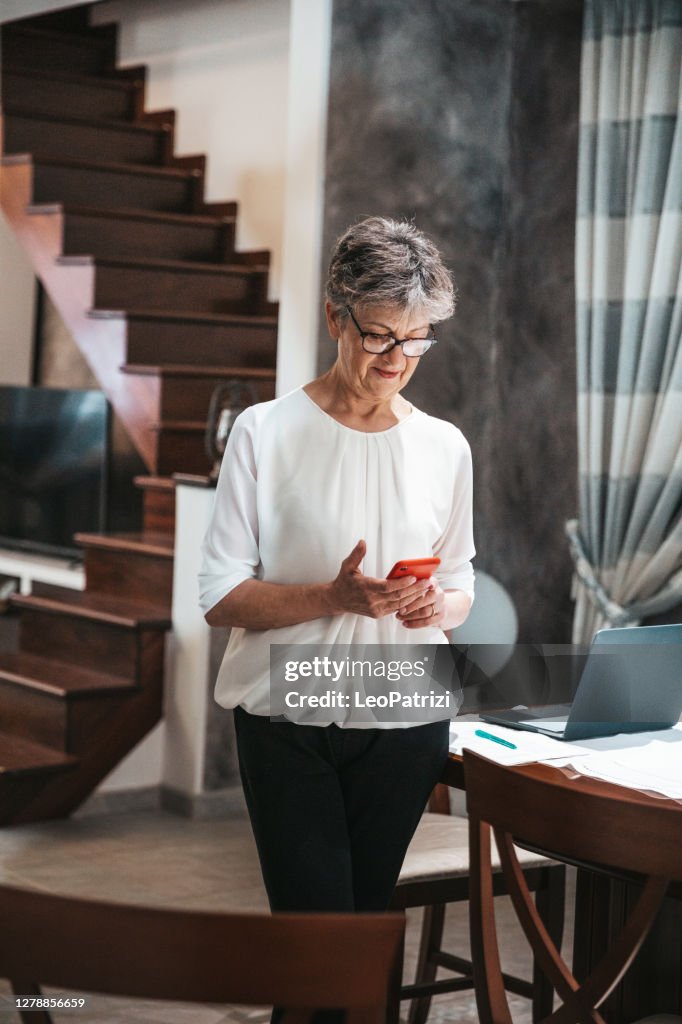 Senior woman texting on mobile