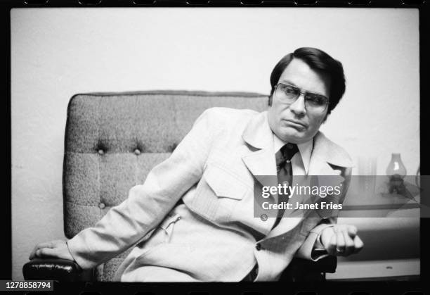 Portrait of American cult leader and founder of the People's Temple Jim Jones as he poses in his office, San Francisco, California, July 3, 1976.