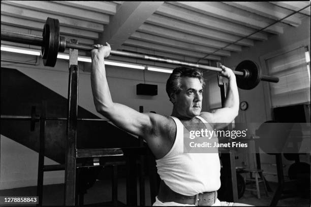 American politician US Representative Barney Frank lifts a barbell as he works out in a gym, Washington DC, February 1986.