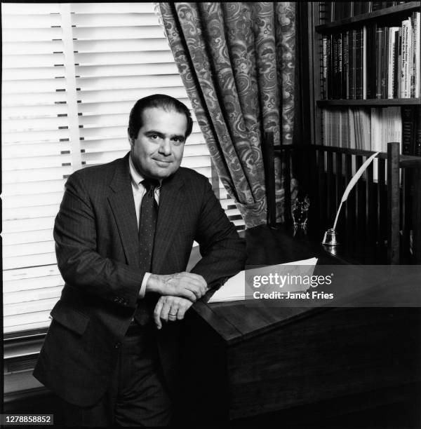 Portrait of American jurist and US Supreme Court Associate Justice Antonin Scalia as he poses in his office at the Court, Washington DC, January 1987.