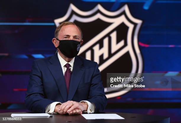 Commissioner Gary Bettman prepares for the first round of the 2020 National Hockey League Draft at the NHL Network Studio on October 06, 2020 in...