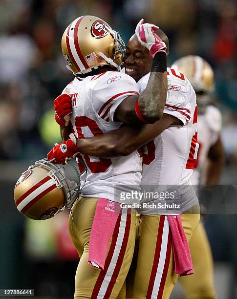 Reggie Smith and Madieu Williams celebrate their 24-23 win over the Philadelphia Eagles during an NFL football game at Lincoln Financial Field on...