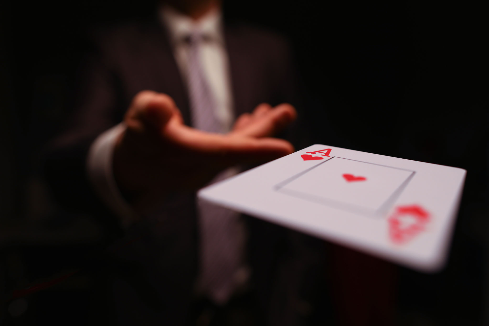 Player throwing playing card Player throwing playing card