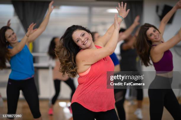 women having fun dancing in fitness class - ymca stock pictures, royalty-free photos & images