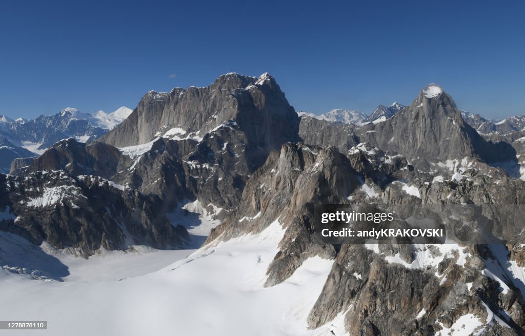 Moose's Tooth and Broken Tooth under blue sky of Alaska