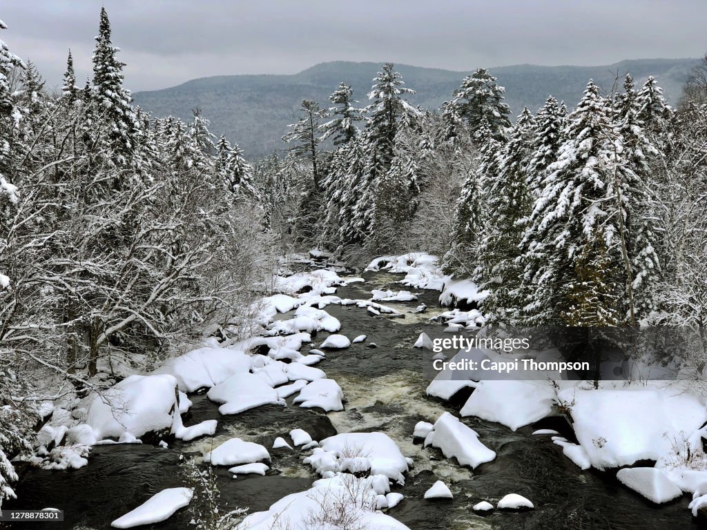 The Magalloway river after a fresh snowstorm near Hollis, Maine USA during winter
