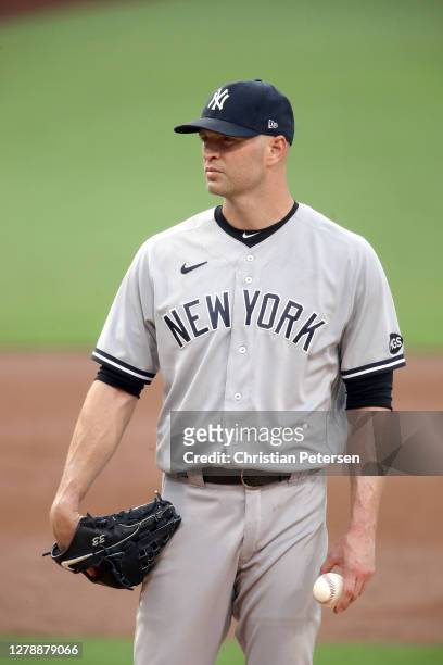 Happ of the New York Yankees reacts after allowing a two run home run to Mike Zunino of the Tampa Bay Rays during the second inning in Game Two of...