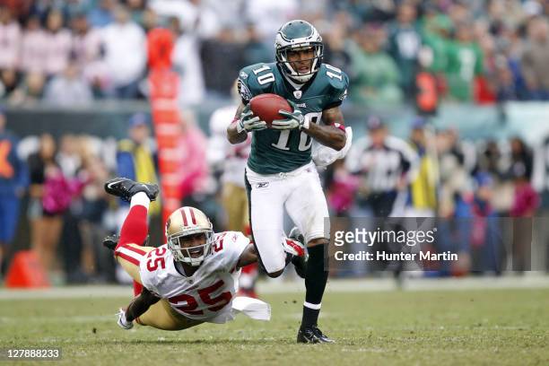 Wide receiver DeSean Jackson of the Philadelphia Eagles runs with the ball as cornerback Tarell Brown of the San Francisco 49ers attempts to make the...