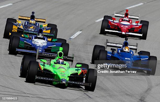 Danica Patrick, driver of the Team GoDaddy Andretti Autosport Dallara Honda leads a pack of cars during the IZOD IndyCar Series Kentucky Indy 300 on...
