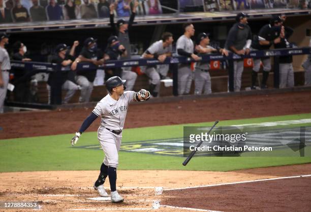Giancarlo Stanton of the New York Yankees watches his three run home run leave the park against the Tampa Bay Rays during the fourth inning in Game...