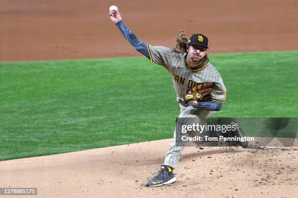 Starting pitcher Mike Clevinger of the San Diego Padres throws against the Los Angeles Dodgers in the first inning of Game One of the National League...