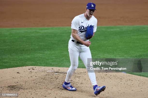 Walker Buehler of the Los Angeles Dodgers reacts after striking out Trent Grisham of the San Diego Padres during Game One of the National League...