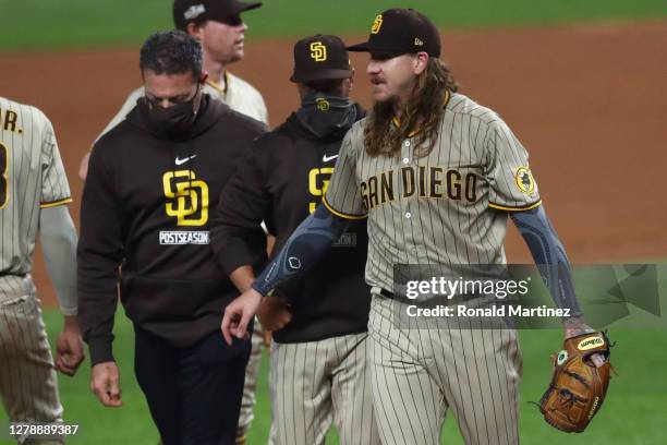 Mike Clevinger of the San Diego Padres exits the game in the second inning due to injury during Game One of the National League Divisional Series...