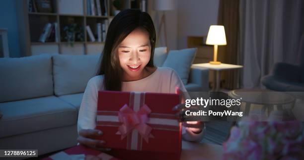 asian woman open present box - christmas surprise stock pictures, royalty-free photos & images