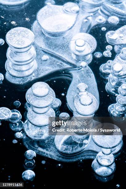 stacks of methane bubbles trapped in ice - icicle macro stock pictures, royalty-free photos & images