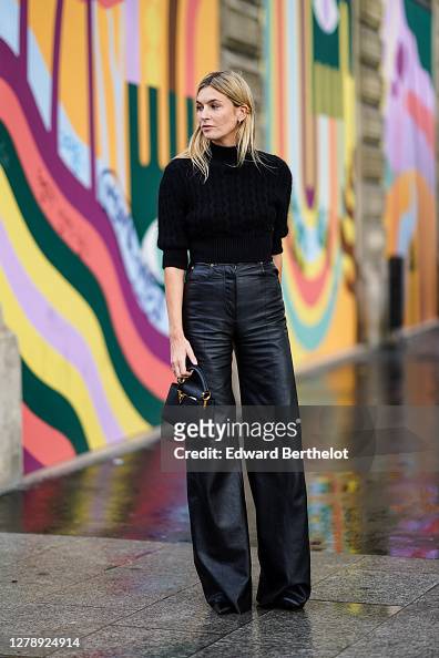 Camille Charriere wears a black turtleneck pullover, black leather ...