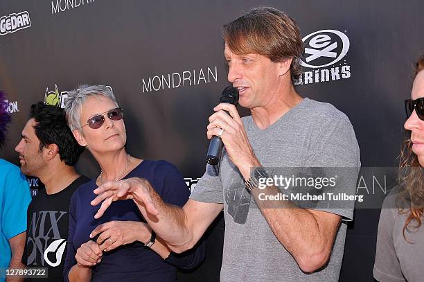 Skateboarding pioneer Tony Hawk speaks as actress Jamie Lee Curtis watches at Tony Hawk's 8th Annual Stand Up For Skateparks Benefit, held at at Ron...