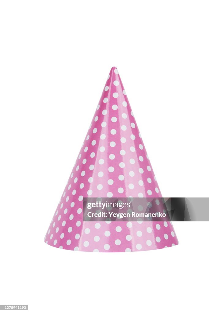 Pink party hat in polka dot isolated on white background