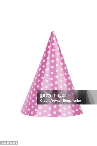 pink party hat in polka dot isolated on white background - birthday hat stock pictures, royalty-free photos & images