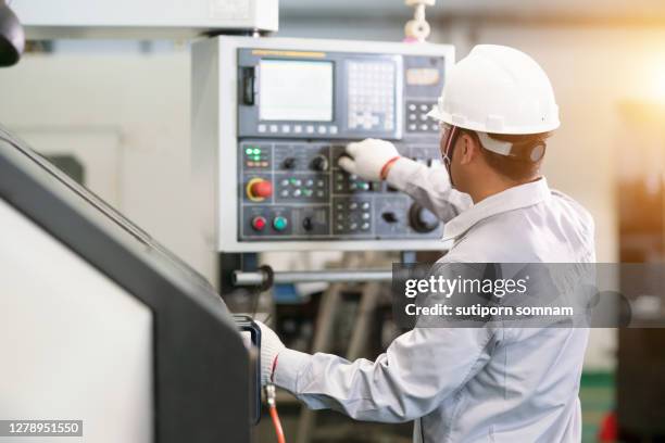 Manually Operating Machine 9,614 Worker Operating Machinery Stock Photos, High-Res Pictures, and ...