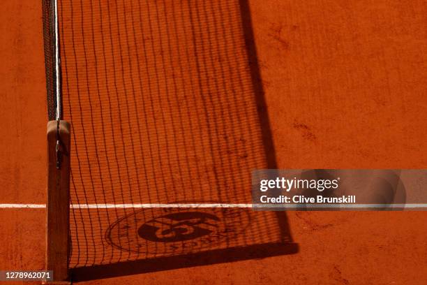 The shadow of the net is seen on Court Philippe-Chatrier during the Women's Singles quarterfinals match between Danielle Collins of The United States...