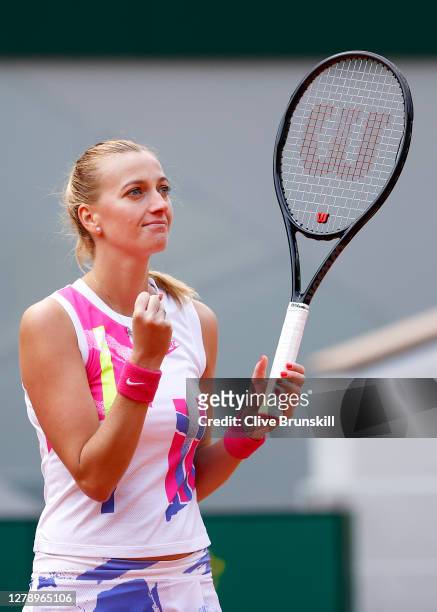 Petra Kvitova of Czech Republic celebrates after winning match point during her Women's Singles quarterfinals match against Laura Siegemund of...