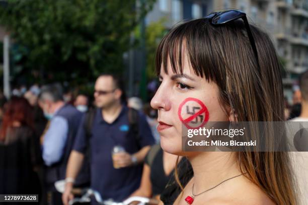Anti-fascist protesters outside the court, where the trial of leaders and members of the Golden Dawn far-right party is taking place on October 7,...