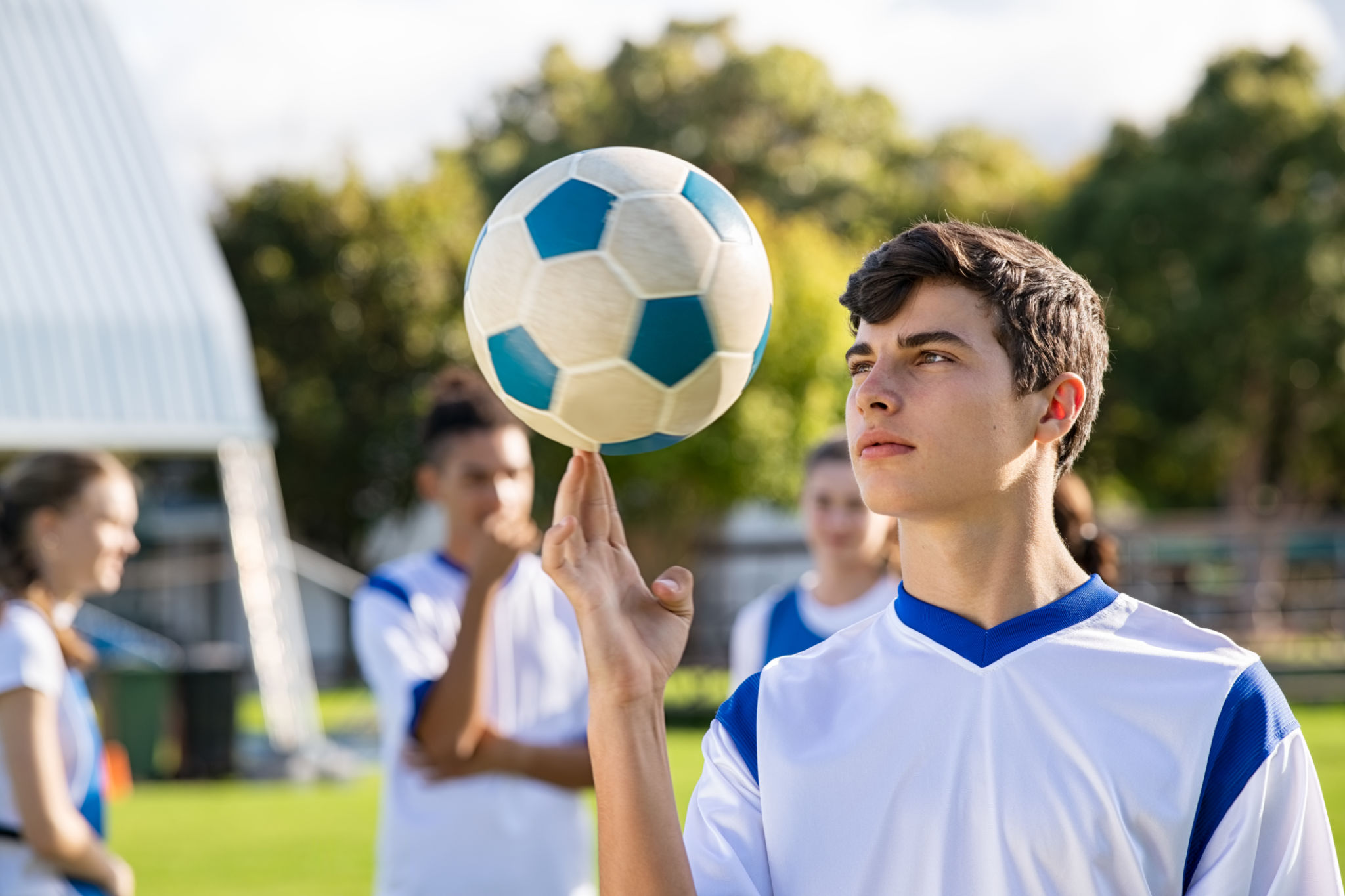 Guy spinning soccer ball on finger Guy spinning soccer ball on finger