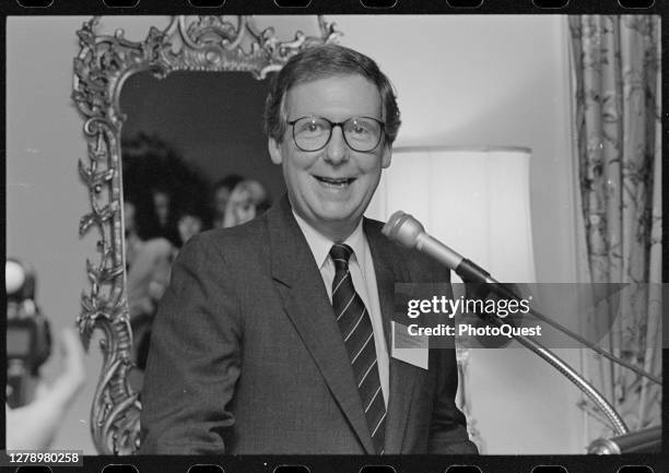 American politician US Senator Mitch McConnell speaks at microphone during a gathering of Republican Party women candidates, Washington DC, June 1992.