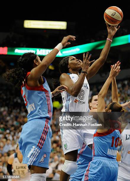 Taj McWilliams-Franklin of the Minnesota Lynx shoots against Lindsey Harding of the Atlanta Dream in the second quarter in Game One of the 2011 WNBA...
