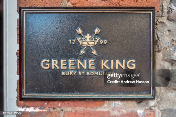 Greene King sign on the Druid's Head in The Lanes, Brighton on October 7, 2020 in Brighton, England. The nationwide pub chain, Greene King has...