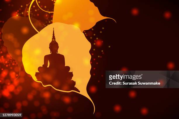 the lord buddha meditated gracefully on a lotus flower with an orange background. (about buddhism) - cultura hindú stockfoto's en -beelden