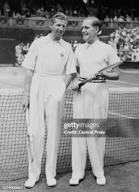 Don Budge of the United States stands beside Baron Gottfried von Cramm of Germany on Centre Court before their Men's Singles Final match at the...