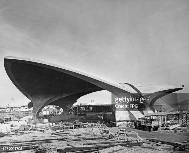 The TWA Flight Center, designed for Trans World Airlines by Eero Saarinen & Associates, under construction at New York International Airport in the...