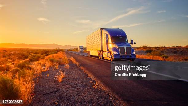 long haul semi truck on a rural western usa interstate highway - truck front view stock pictures, royalty-free photos & images