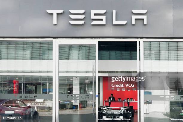 The Tesla logo is pictured at a Tesla showroom and service center on October 6, 2020 in Beijing, China.
