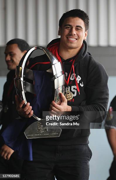 Ben Henry of the Junior Warriors holds the Toyota Cup as the team arrive at Auckland International Airport on October 3, 2011 in Auckland, New...