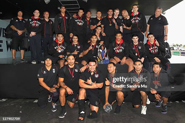 The Junior Warriors celebrate with the Toyota Cup as the team arrive at Auckland International Airport on October 3, 2011 in Auckland, New Zealand....