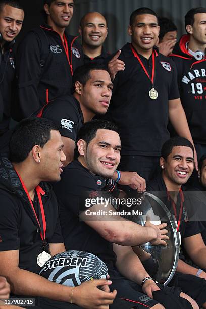 Konrad Hurrell of the Junior Warriors touches the Toyota Cup as the team arrive at Auckland International Airport on October 3, 2011 in Auckland, New...