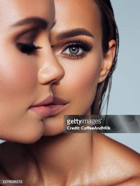close-up portrait of two beautiful girls - beautiful woman stock pictures, royalty-free photos & images
